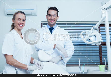 To use this stock image in your creative project, please select the size you need over to the right and click the "Add to Cart" button.
Your downloaded image will come with the Cutcaster watermark removed so don’t worry about the watermark you see on this page. Portrait of smiling dentists stock photo, Portrait of smiling male and female dentists by Wavebreak Media