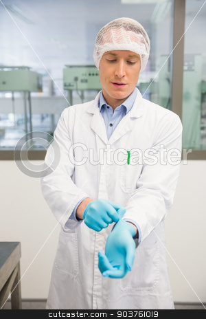 To use this stock image in your creative project, please select the size you need over to the right and click the "Add to Cart" button.
Your downloaded image will come with the Cutcaster watermark removed so don’t worry about the watermark you see on this page. Pharmacist pulling on rubber gloves stock photo, Pharmacist pulling on rubber gloves at the hospital pharmacy by Wavebreak Media