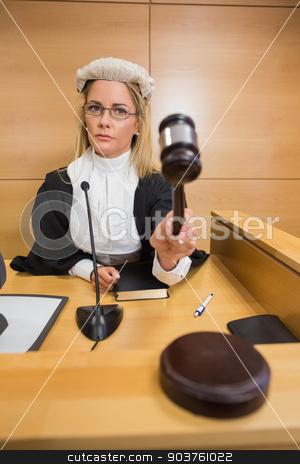 To use this stock image in your creative project, please select the size you need over to the right and click the "Add to Cart" button.
Your downloaded image will come with the Cutcaster watermark removed so don’t worry about the watermark you see on this page. Stern judge banging her hammer stock photo, Stern judge banging her hammer in the court room by Wavebreak Media