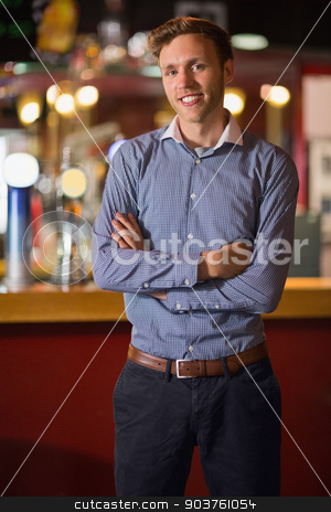 To use this stock image in your creative project, please select the size you need over to the right and click the "Add to Cart" button.
Your downloaded image will come with the Cutcaster watermark removed so don’t worry about the watermark you see on this page. Handsome young man smiling with arms crossed stock photo, Handsome young man smiling with arms crossed in a bar by Wavebreak Media