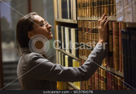 To use this stock image in your creative project, please select the size you need over to the right and click the "Add to Cart" button.
Your downloaded image will come with the Cutcaster watermark removed so don’t worry about the watermark you see on this page. Lawyer picking book in the law library stock photo, Lawyer picking book in the law library at the university by Wavebreak Media