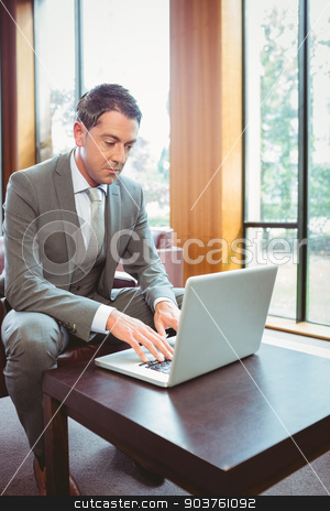 To use this stock image in your creative project, please select the size you need over to the right and click the "Add to Cart" button.
Your downloaded image will come with the Cutcaster watermark removed so don’t worry about the watermark you see on this page. Focused handsome businessman working at laptop stock photo, Focused handsome businessman working at laptop in the office by Wavebreak Media