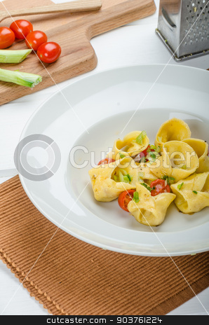 To use this stock image in your creative project, please select the size you need over to the right and click the "Add to Cart" button.
Your downloaded image will come with the Cutcaster watermark removed so don’t worry about the watermark you see on this page. Homemade tortellini stock photo, Homemade tortellini from semolina flour, stuffed with Parmesan cheese and tomatoes by Peteer