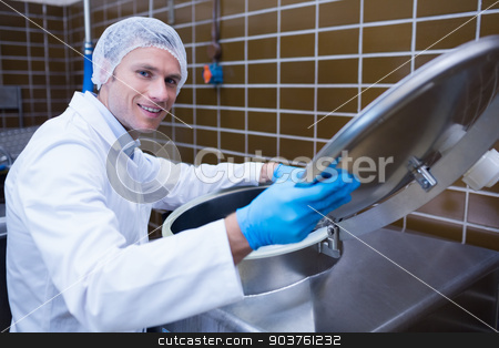 To use this stock image in your creative project, please select the size you need over to the right and click the "Add to Cart" button.
Your downloaded image will come with the Cutcaster watermark removed so don’t worry about the watermark you see on this page. Smiling man in lab coat opening the lid of the machine stock photo, Smiling man in lab coat opening the lid of the machine in the factory by Wavebreak Media