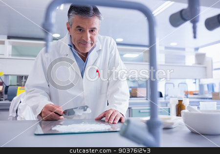 To use this stock image in your creative project, please select the size you need over to the right and click the "Add to Cart" button.
Your downloaded image will come with the Cutcaster watermark removed so don’t worry about the watermark you see on this page. Smiling biochemist preparing some medicine stock photo, Smiling biochemist preparing some medicine in laboratory by Wavebreak Media