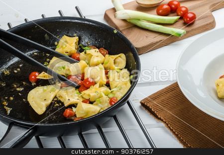 To use this stock image in your creative project, please select the size you need over to the right and click the "Add to Cart" button.
Your downloaded image will come with the Cutcaster watermark removed so don’t worry about the watermark you see on this page. Homemade tortellini stock photo, Homemade tortellini from semolina flour, stuffed with Parmesan cheese and tomatoes by Peteer