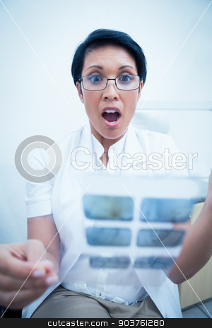 To use this stock image in your creative project, please select the size you need over to the right and click the "Add to Cart" button.
Your downloaded image will come with the Cutcaster watermark removed so don’t worry about the watermark you see on this page. Shocked dentist looking at x-ray stock photo, Shocked female dentist looking at x-ray by Wavebreak Media
