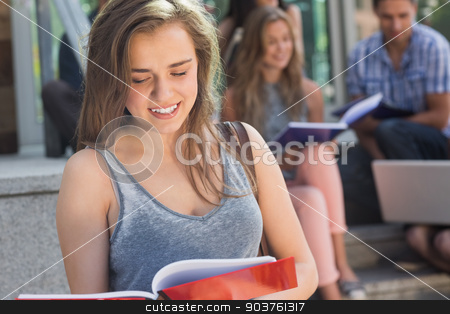 To use this stock image in your creative project, please select the size you need over to the right and click the "Add to Cart" button.
Your downloaded image will come with the Cutcaster watermark removed so don’t worry about the watermark you see on this page. Pretty student reading from notepad stock photo, Pretty student reading from notepad at the university by Wavebreak Media