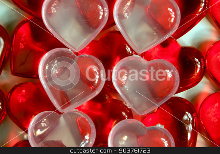 To use this stock image in your creative project, please select the size you need over to the right and click the "Add to Cart" button.
Your downloaded image will come with the Cutcaster watermark removed so don’t worry about the watermark you see on this page. Hearts stock photo, Rows of red plastic hearts with clear hearts on top. by Scott Sanders