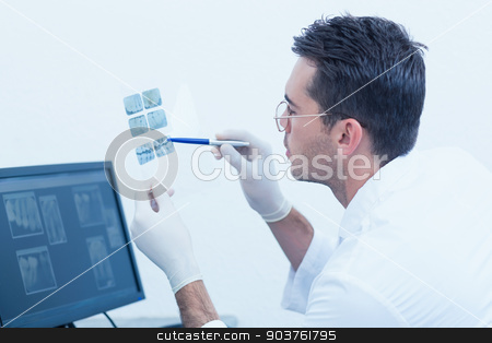 To use this stock image in your creative project, please select the size you need over to the right and click the "Add to Cart" button.
Your downloaded image will come with the Cutcaster watermark removed so don’t worry about the watermark you see on this page. Concentrated male dentist looking at x-ray stock photo, Side view of concentrated male dentist looking at x-ray by Wavebreak Media