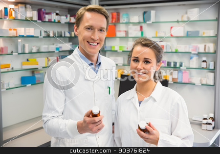 To use this stock image in your creative project, please select the size you need over to the right and click the "Add to Cart" button.
Your downloaded image will come with the Cutcaster watermark removed so don’t worry about the watermark you see on this page. Team of pharmacists smiling at camera stock photo, Team of pharmacists smiling at camera at the hospital pharmacy by Wavebreak Media