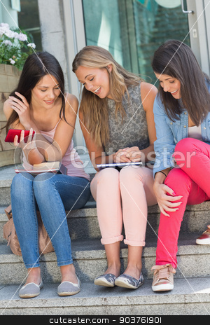 To use this stock image in your creative project, please select the size you need over to the right and click the "Add to Cart" button.
Your downloaded image will come with the Cutcaster watermark removed so don’t worry about the watermark you see on this page. Happy students sitting on steps chatting stock photo, Happy students sitting on steps chatting at the university by Wavebreak Media