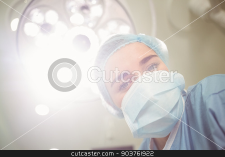 To use this stock image in your creative project, please select the size you need over to the right and click the "Add to Cart" button.
Your downloaded image will come with the Cutcaster watermark removed so don’t worry about the watermark you see on this page. Young surgeon looking down at camera stock photo, Young surgeon looking down at camera at the university by Wavebreak Media