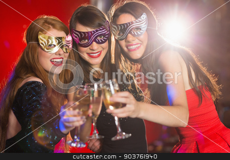 To use this stock image in your creative project, please select the size you need over to the right and click the "Add to Cart" button.
Your downloaded image will come with the Cutcaster watermark removed so don’t worry about the watermark you see on this page. Friends in masquerade masks toasting with champagne stock photo, Friends in masquerade masks toasting with champagne at the nightclub by Wavebreak Media