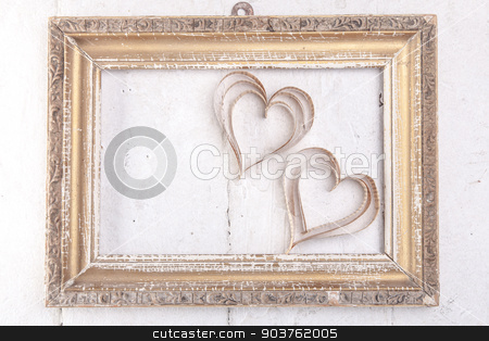 To use this stock image in your creative project, please select the size you need over to the right and click the "Add to Cart" button.
Your downloaded image will come with the Cutcaster watermark removed so don’t worry about the watermark you see on this page. Heart-shaped cutout St Valentines hearts stock photo, Vintage book heart shaped cutout in vintage frame by Oleksandr Solonenko