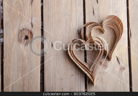 To use this stock image in your creative project, please select the size you need over to the right and click the "Add to Cart" button.
Your downloaded image will come with the Cutcaster watermark removed so don’t worry about the watermark you see on this page. Heart-shaped cutout St Valentines hearts stock photo, Vintage book heart shaped cutout on rough wood board texture background by Oleksandr Solonenko