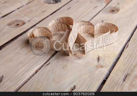 To use this stock image in your creative project, please select the size you need over to the right and click the "Add to Cart" button.
Your downloaded image will come with the Cutcaster watermark removed so don’t worry about the watermark you see on this page. Heart-shaped cutout St Valentines hearts stock photo, Vintage book heart shaped cutout on rough wood board texture background by Oleksandr Solonenko