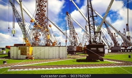 To use this stock image in your creative project, please select the size you need over to the right and click the "Add to Cart" button.
Your downloaded image will come with the Cutcaster watermark removed so don’t worry about the watermark you see on this page. Construction site stock photo, Construction site with various machines by Dariusz Miszkiel