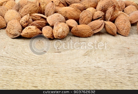 To use this stock image in your creative project, please select the size you need over to the right and click the "Add to Cart" button.
Your downloaded image will come with the Cutcaster watermark removed so don’t worry about the watermark you see on this page. Group of almonds with shell on wooden plank,board stock photo, Group of almonds with shell on wooden plank by Tadeusz Wejkszo