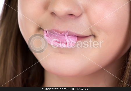 To use this stock image in your creative project, please select the size you need over to the right and click the "Add to Cart" button.
Your downloaded image will come with the Cutcaster watermark removed so don’t worry about the watermark you see on this page. Photo of bursted bubble stock photo, Photo of bursted bubble on teenage girl's lips by Chris Tefme