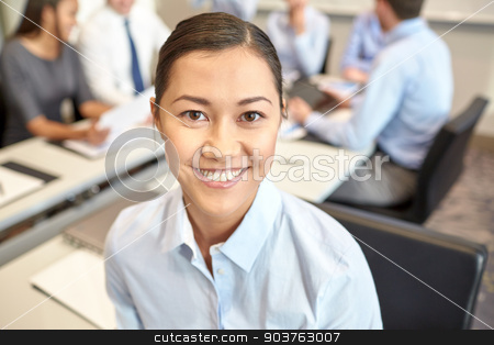 To use this stock image in your creative project, please select the size you need over to the right and click the "Add to Cart" button.
Your downloaded image will come with the Cutcaster watermark removed so don’t worry about the watermark you see on this page. group of smiling businesspeople meeting in office stock photo, business, people and teamwork concept - smiling businesswoman with group of businesspeople meeting in office by Syda Productions