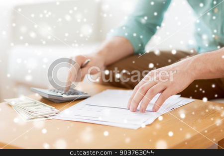 To use this stock image in your creative project, please select the size you need over to the right and click the "Add to Cart" button.
Your downloaded image will come with the Cutcaster watermark removed so don’t worry about the watermark you see on this page. close up of man counting money and making notes stock photo, savings, finances, paperwork and people concept - close up of man with calculator counting money and making notes at home by Syda Productions