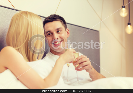 To use this stock image in your creative project, please select the size you need over to the right and click the "Add to Cart" button.
Your downloaded image will come with the Cutcaster watermark removed so don’t worry about the watermark you see on this page. smiling couple with champagne glasses in bed stock photo, hotel, travel, relationships and happiness concept - smiling couple with champagne glasses in bed by Syda Productions