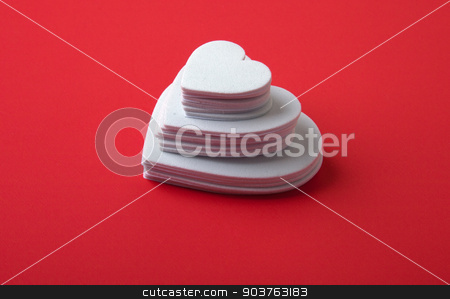 To use this stock image in your creative project, please select the size you need over to the right and click the "Add to Cart" button.
Your downloaded image will come with the Cutcaster watermark removed so don’t worry about the watermark you see on this page. White Hearts stock photo, White foam hearts on a red background. by Scott Sanders