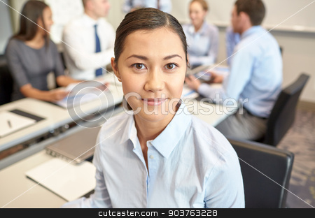 To use this stock image in your creative project, please select the size you need over to the right and click the "Add to Cart" button.
Your downloaded image will come with the Cutcaster watermark removed so don’t worry about the watermark you see on this page. group of smiling businesspeople meeting in office stock photo, business, people and teamwork concept - smiling businesswoman with group of businesspeople meeting in office by Syda Productions