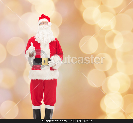 To use this stock image in your creative project, please select the size you need over to the right and click the "Add to Cart" button.
Your downloaded image will come with the Cutcaster watermark removed so don’t worry about the watermark you see on this page. man in costume of santa claus stock photo, christmas, holidays, gesture and people concept- man in costume of santa claus showing thumbs up over beige lights background by Syda Productions
