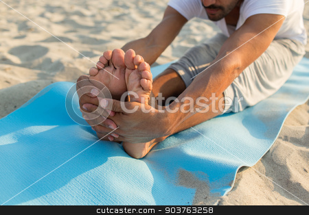 To use this stock image in your creative project, please select the size you need over to the right and click the "Add to Cart" button.
Your downloaded image will come with the Cutcaster watermark removed so don’t worry about the watermark you see on this page. close up of man making yoga exercises outdoors stock photo, fitness, sport, people and lifestyle concept - close up of man making yoga exercises on mat outdoors by Syda Productions