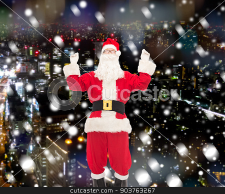 To use this stock image in your creative project, please select the size you need over to the right and click the "Add to Cart" button.
Your downloaded image will come with the Cutcaster watermark removed so don’t worry about the watermark you see on this page. man in costume of santa claus stock photo, christmas, holidays and people concept - man in costume of santa claus having fun over snowy city background by Syda Productions