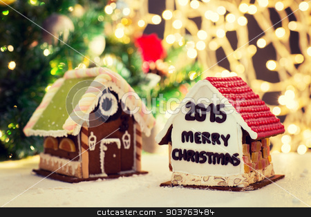 To use this stock image in your creative project, please select the size you need over to the right and click the "Add to Cart" button.
Your downloaded image will come with the Cutcaster watermark removed so don’t worry about the watermark you see on this page. closeup of beautiful gingerbread houses at home stock photo, holidays, christmas, baking and sweets concept - closeup of beautiful gingerbread houses on table over lights background by Syda Productions