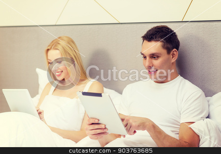 To use this stock image in your creative project, please select the size you need over to the right and click the "Add to Cart" button.
Your downloaded image will come with the Cutcaster watermark removed so don’t worry about the watermark you see on this page. smiling couple in bed with tablet pc computers stock photo, hotel, travel, relationships, technology, intermet and happiness concept - smiling couple in bed with tablet computers by Syda Productions
