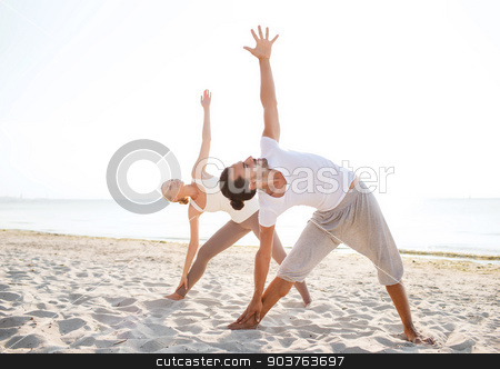 To use this stock image in your creative project, please select the size you need over to the right and click the "Add to Cart" button.
Your downloaded image will come with the Cutcaster watermark removed so don’t worry about the watermark you see on this page. couple making yoga exercises outdoors stock photo, fitness, sport, friendship and lifestyle concept - couple making yoga exercises on beach by Syda Productions