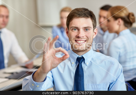 To use this stock image in your creative project, please select the size you need over to the right and click the "Add to Cart" button.
Your downloaded image will come with the Cutcaster watermark removed so don’t worry about the watermark you see on this page. group of smiling businesspeople meeting in office stock photo, business, people, gesture and teamwork concept - smiling businessman showing ok gesture with group of businesspeople meeting in office by Syda Productions