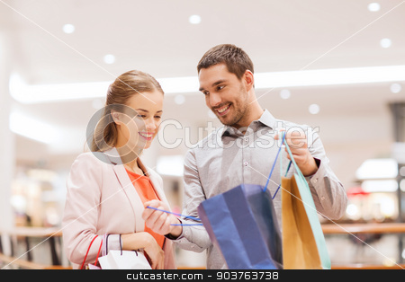 To use this stock image in your creative project, please select the size you need over to the right and click the "Add to Cart" button.
Your downloaded image will come with the Cutcaster watermark removed so don’t worry about the watermark you see on this page. happy young couple with shopping bags in mall stock photo, sale, consumerism and people concept - happy young couple showing content of shopping bags in mall by Syda Productions