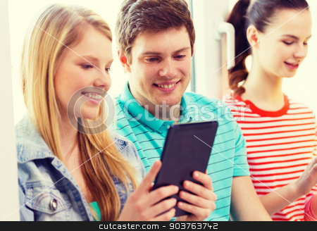 To use this stock image in your creative project, please select the size you need over to the right and click the "Add to Cart" button.
Your downloaded image will come with the Cutcaster watermark removed so don’t worry about the watermark you see on this page. smiling students with tablet pc at school stock photo, education, technology and internet concept - smiling students looking at tablet pc computer at school by Syda Productions