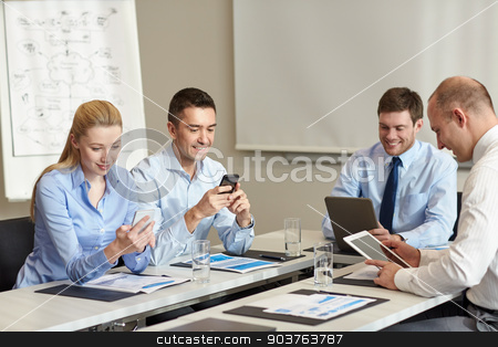 To use this stock image in your creative project, please select the size you need over to the right and click the "Add to Cart" button.
Your downloaded image will come with the Cutcaster watermark removed so don’t worry about the watermark you see on this page. smiling business people with gadgets in office stock photo, business, people and technology concept - smiling business team with smartphone and papers meeting in office by Syda Productions