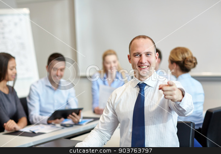 To use this stock image in your creative project, please select the size you need over to the right and click the "Add to Cart" button.
Your downloaded image will come with the Cutcaster watermark removed so don’t worry about the watermark you see on this page. group of smiling businesspeople meeting in office stock photo, business, people, gesture and teamwork concept - smiling businessman pointing finger to you with group of businesspeople meeting in office by Syda Productions
