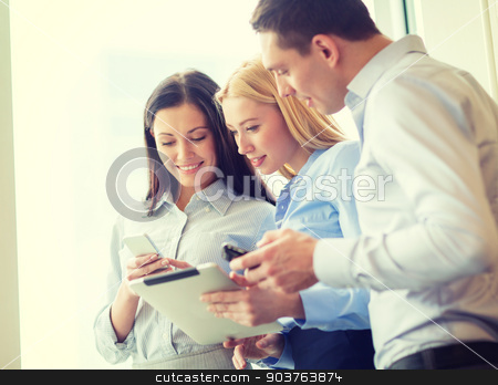 To use this stock image in your creative project, please select the size you need over to the right and click the "Add to Cart" button.
Your downloaded image will come with the Cutcaster watermark removed so don’t worry about the watermark you see on this page. business team working with tablet pcs in office stock photo, business and office concept - smiling business team working with tablet pcs and smartphones in office by Syda Productions