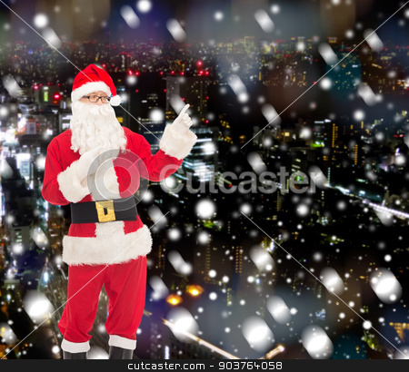 To use this stock image in your creative project, please select the size you need over to the right and click the "Add to Cart" button.
Your downloaded image will come with the Cutcaster watermark removed so don’t worry about the watermark you see on this page. man in costume of santa claus stock photo, christmas, holidays, gesture and people concept - man in costume of santa claus pointing fingers over snowy night city background by Syda Productions