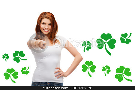 To use this stock image in your creative project, please select the size you need over to the right and click the "Add to Cart" button.
Your downloaded image will come with the Cutcaster watermark removed so don’t worry about the watermark you see on this page. smiling girl in white t-shirt pointing at you stock photo, gestures, holidays, st. patricks day and people concept - happy teenager in blank white t-shirt pointing at you over white background with green shamrock or clover by Syda Productions