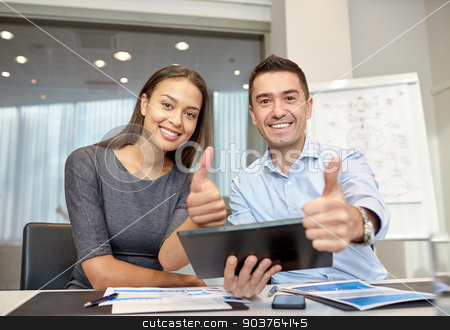 To use this stock image in your creative project, please select the size you need over to the right and click the "Add to Cart" button.
Your downloaded image will come with the Cutcaster watermark removed so don’t worry about the watermark you see on this page. smiling businesspeople with tablet pc in office stock photo, business, people, technology and teamwork concept - smiling businessman and businesswoman with tablet pc computer showing thumbs up gesture meeting in office by Syda Productions