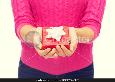 To use this stock image in your creative project, please select the size you need over to the right and click the "Add to Cart" button.
Your downloaded image will come with the Cutcaster watermark removed so don’t worry about the watermark you see on this page. close up of woman in pink sweater holding gift box stock photo, christmas, holidays and people concept - close up of woman in pink sweater holding gift box by Syda Productions