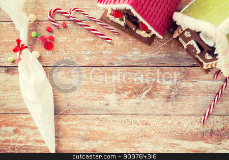 To use this stock image in your creative project, please select the size you need over to the right and click the "Add to Cart" button.
Your downloaded image will come with the Cutcaster watermark removed so don’t worry about the watermark you see on this page. closeup of beautiful gingerbread houses at home stock photo, holidays, christmas, baking and sweets concept - closeup of beautiful gingerbread houses at home by Syda Productions