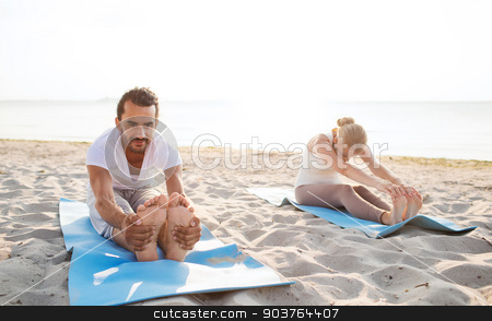 To use this stock image in your creative project, please select the size you need over to the right and click the "Add to Cart" button.
Your downloaded image will come with the Cutcaster watermark removed so don’t worry about the watermark you see on this page. couple making yoga exercises outdoors stock photo, fitness, sport, friendship and lifestyle concept - couple making yoga exercises sitting on mats outdoors by Syda Productions