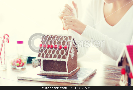 To use this stock image in your creative project, please select the size you need over to the right and click the "Add to Cart" button.
Your downloaded image will come with the Cutcaster watermark removed so don’t worry about the watermark you see on this page. close up of woman making gingerbread house at home stock photo, cooking, people, christmas and decoration concept - close up of woman making gingerbread houses at home by Syda Productions