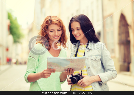 To use this stock image in your creative project, please select the size you need over to the right and click the "Add to Cart" button.
Your downloaded image will come with the Cutcaster watermark removed so don’t worry about the watermark you see on this page. smiling teenage girls with map and camera stock photo, tourism, travel, leisure, holidays and friendship concept - smiling teenage girls with map and camera outdoors by Syda Productions