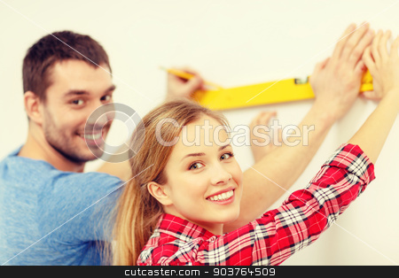 To use this stock image in your creative project, please select the size you need over to the right and click the "Add to Cart" button.
Your downloaded image will come with the Cutcaster watermark removed so don’t worry about the watermark you see on this page. couple building using spirit level to measure stock photo, repair, building and home concept - smiling couple building new home using spirit level to measure by Syda Productions